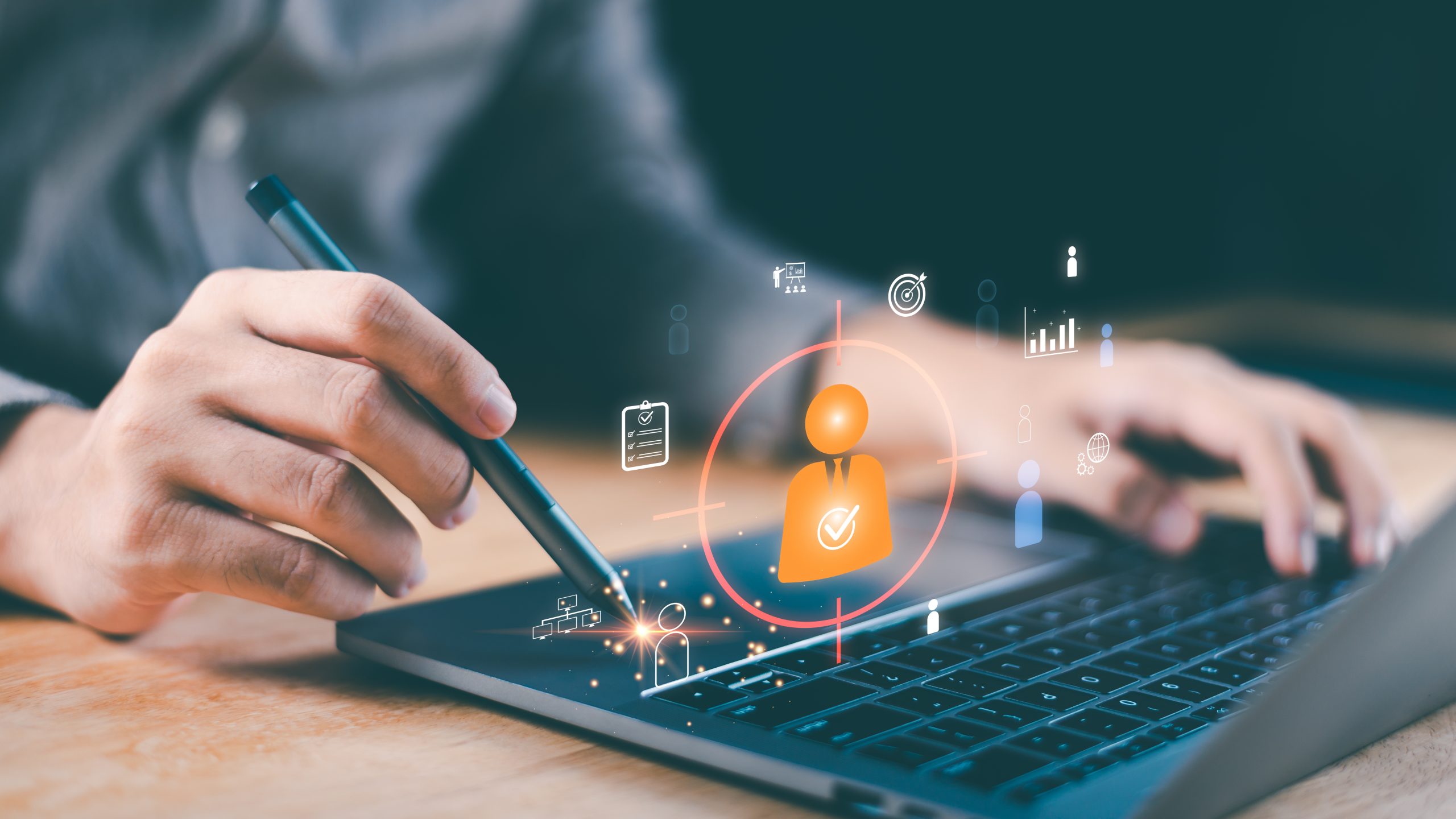 Close-up hand using stylus on laptop with digital UI for HR analytics and candidate targeting. Illustrates AI recruitment, smart resume filtering, modern workforce optimization in tech-driven hiring